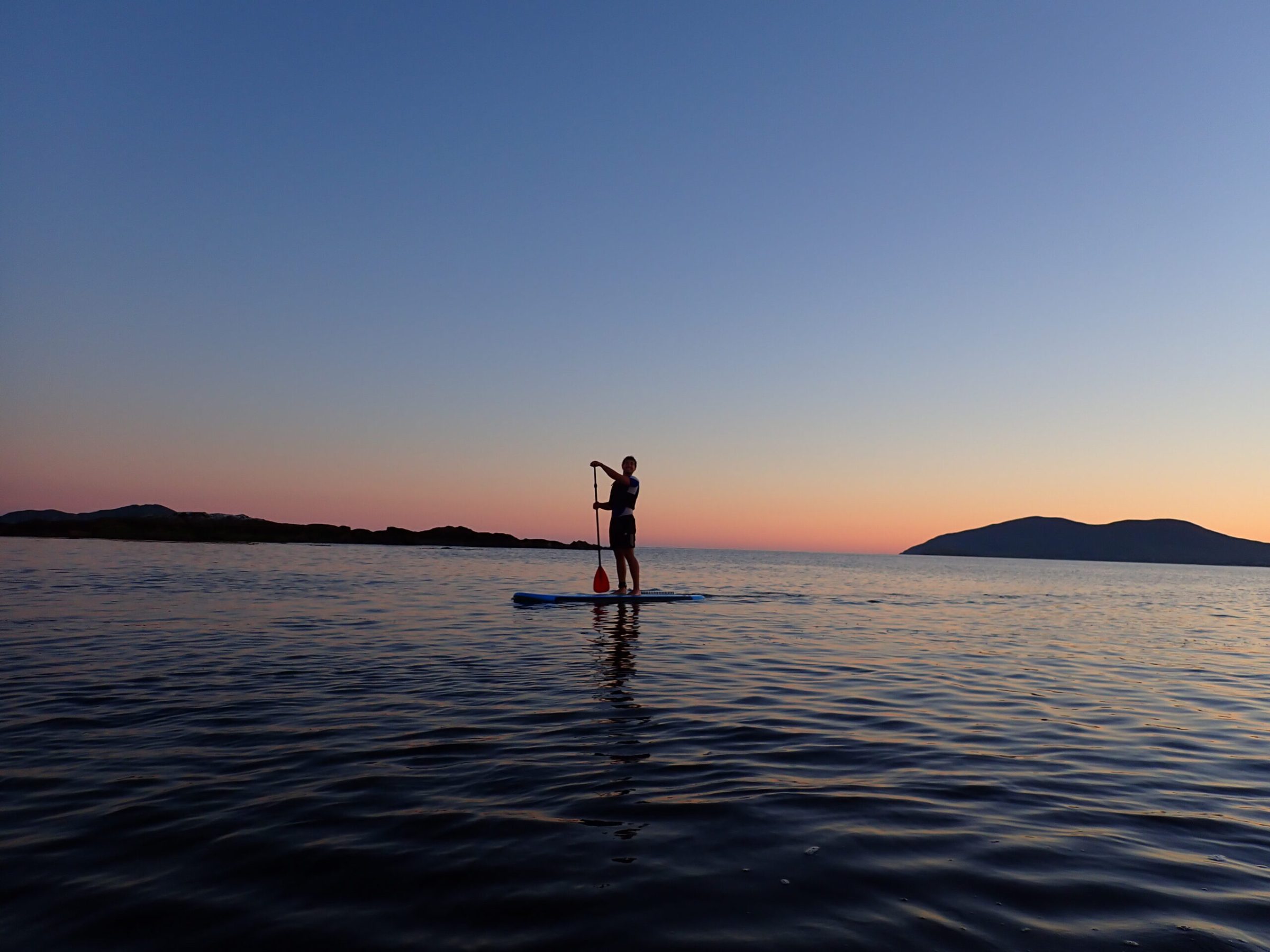 a sunset over a body of water
