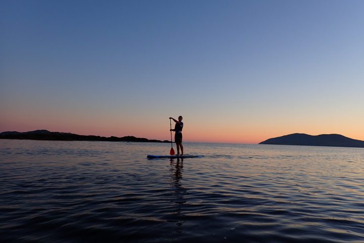 a sunset over a body of water