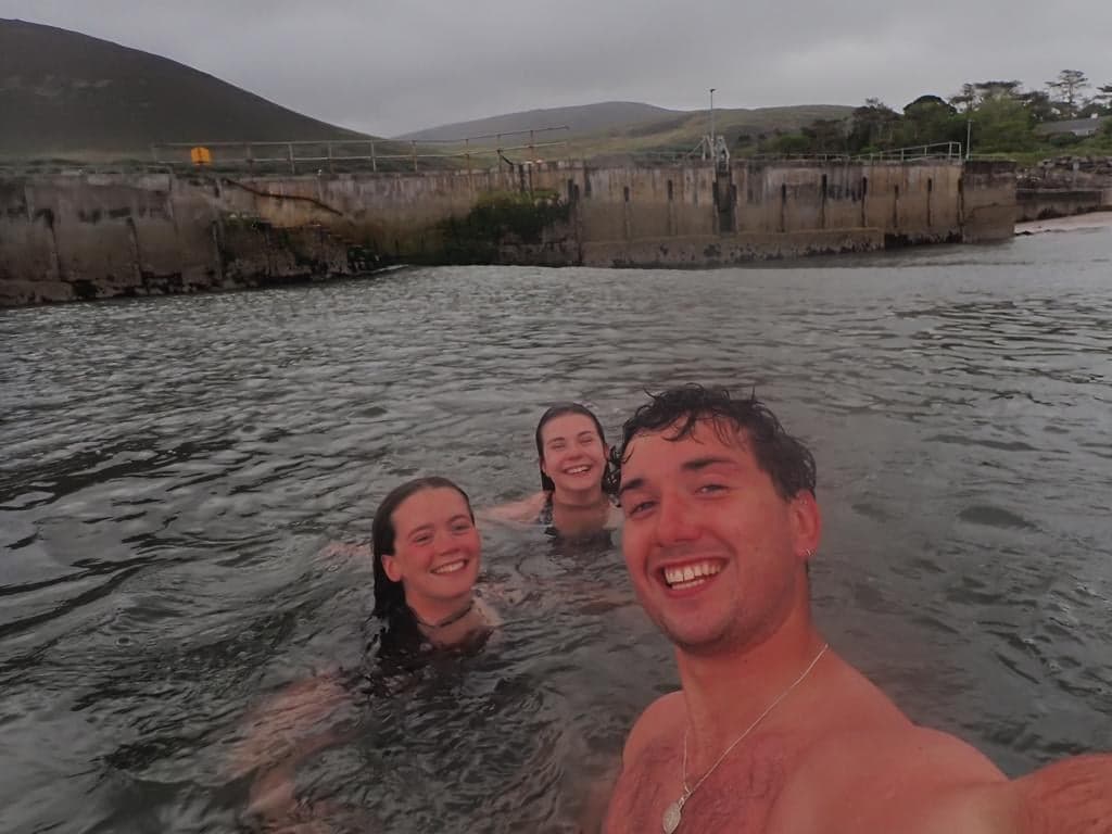seasynergy a man and woman swimming in the water
